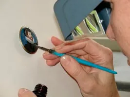 Applying gold lustre to a finished enamel miniature